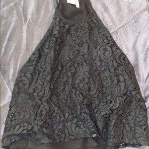Black lacy flowy tank it’s a little cropped but not much